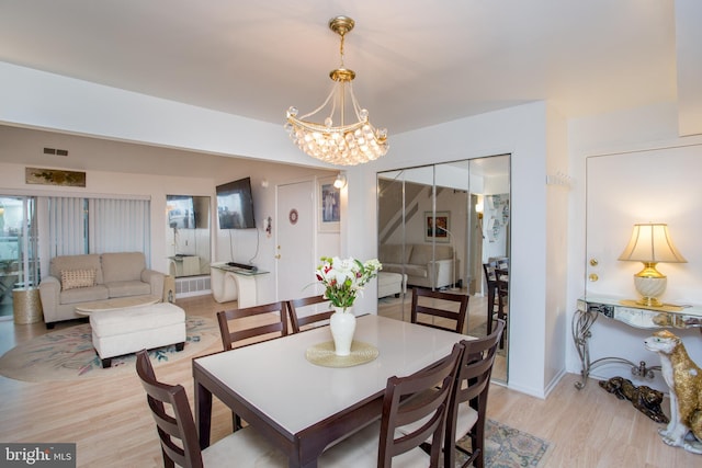 48 Bonnie Gellman Ct Unit B48, Philadelphia, PA 19114 - dining room featuring a chandelier and light wood-type flooring