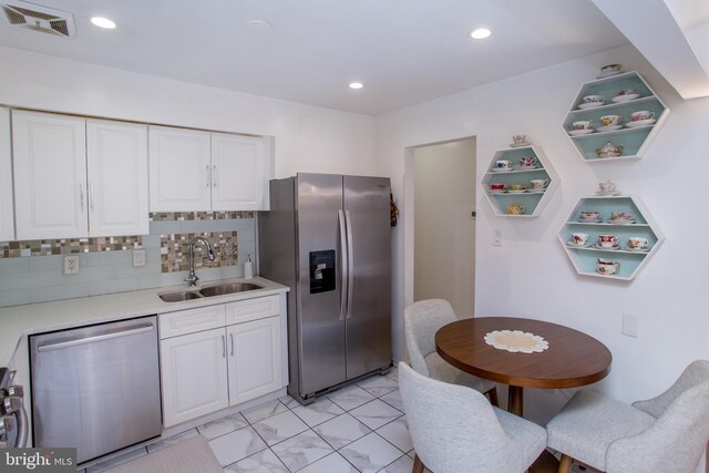 48 Bonnie Gellman Ct Unit B48, Philadelphia, PA 19114 - kitchen featuring appliances with stainless steel finishes, a sink, white cabinets, light countertops, and tasteful backsplash