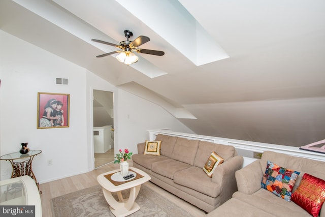 48 Bonnie Gellman Ct Unit B48, Philadelphia, PA 19114 - living area with vaulted ceiling, a skylight, wood finished floors, and ceiling fan