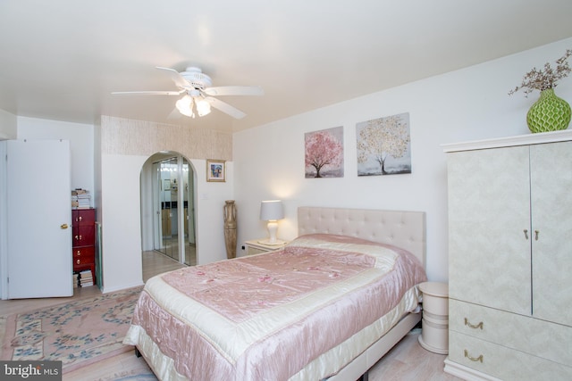 48 Bonnie Gellman Ct Unit B48, Philadelphia, PA 19114 - bedroom featuring arched walkways, wood finished floors, a ceiling fan, and a closet