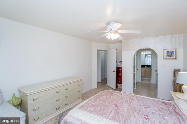 48 Bonnie Gellman Ct Unit B48, Philadelphia, PA 19114 - bedroom with arched walkways, light wood-style floors, and a ceiling fan