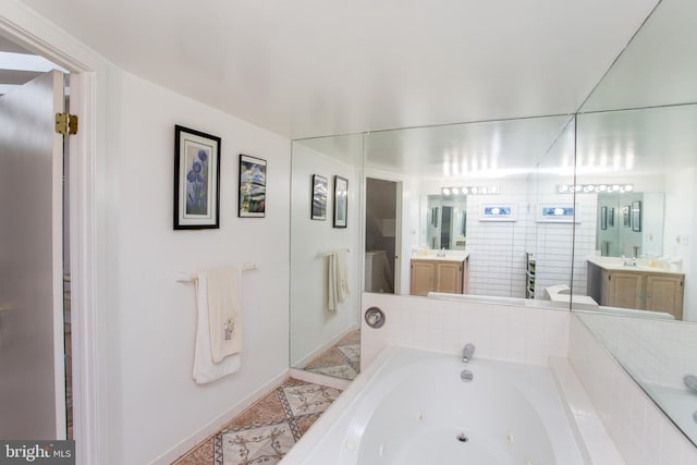 48 Bonnie Gellman Ct Unit B48, Philadelphia, PA 19114 - full bathroom featuring a jetted tub, vanity, and baseboards