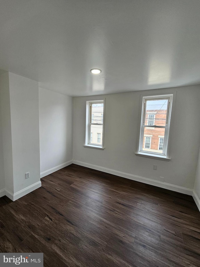 3173 Salmon St, Philadelphia, PA 19134 - unfurnished room with dark wood-type flooring, baseboards, and recessed lighting