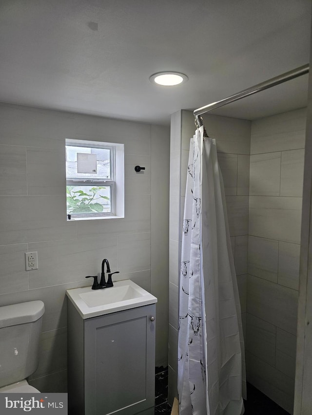 3173 Salmon St, Philadelphia, PA 19134 - full bath with toilet, a tile shower, vanity, and tile walls