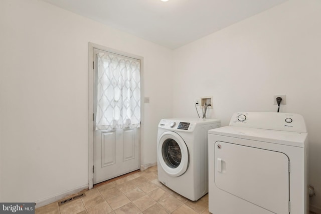 laundry area with washer and clothes dryer