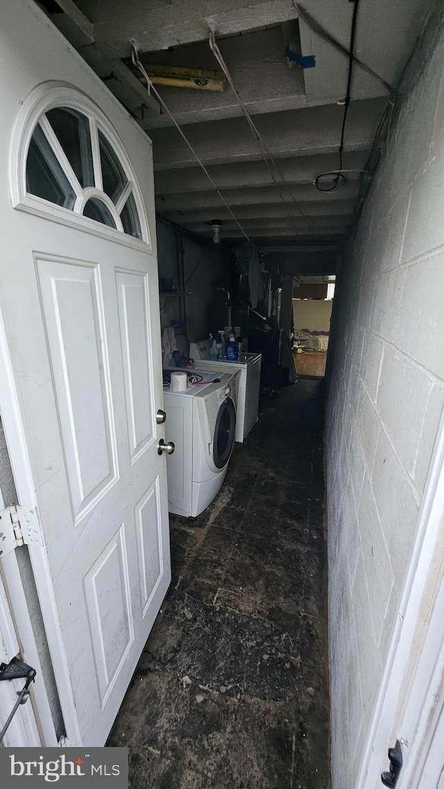 2209 Brighton St, Philadelphia, PA 19149 - corridor featuring washing machine and clothes dryer and concrete block wall