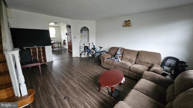 2209 Brighton St, Philadelphia, PA 19149 - living area featuring arched walkways and dark wood-type flooring
