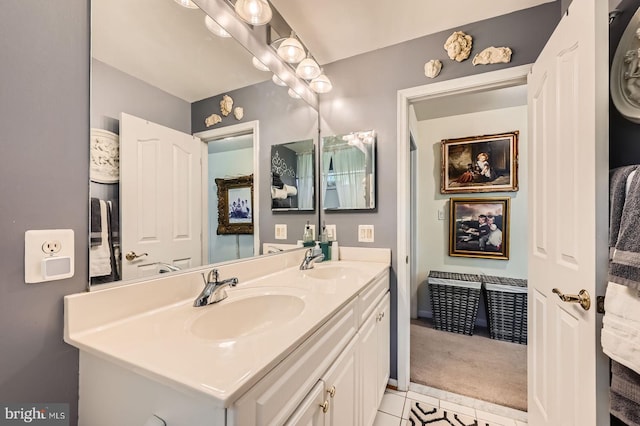 bathroom with double vanity and tile patterned floors
