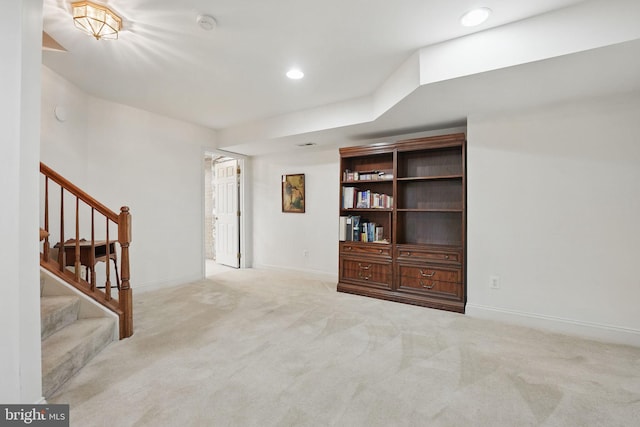 interior space featuring carpet floors, stairs, baseboards, and recessed lighting