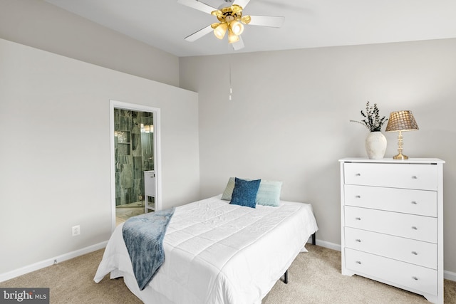bedroom with carpet floors, baseboards, lofted ceiling, connected bathroom, and a ceiling fan