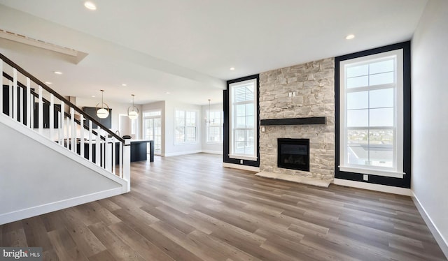 2030 N Fall Harvest Dr, Mechanicsburg, PA 17055 - unfurnished living room featuring plenty of natural light, stairway, baseboards, and recessed lighting