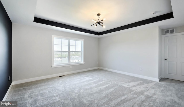 2030 N Fall Harvest Dr, Mechanicsburg, PA 17055 - carpeted spare room with a chandelier, a tray ceiling, and baseboards