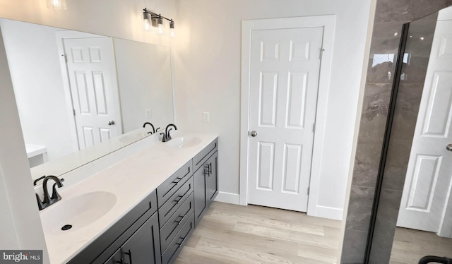 2030 N Fall Harvest Dr, Mechanicsburg, PA 17055 - full bathroom featuring wood finished floors, a stall shower, double vanity, and baseboards