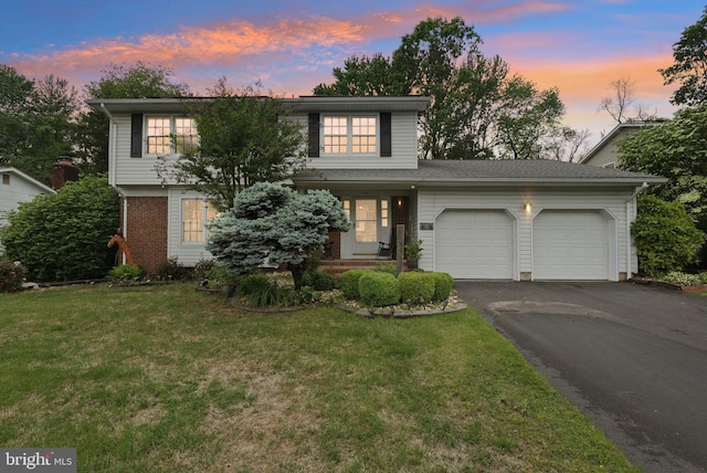 11 Moro Dr, Hamilton, NJ 08619 - traditional-style house with an attached garage, driveway, a lawn, and brick siding