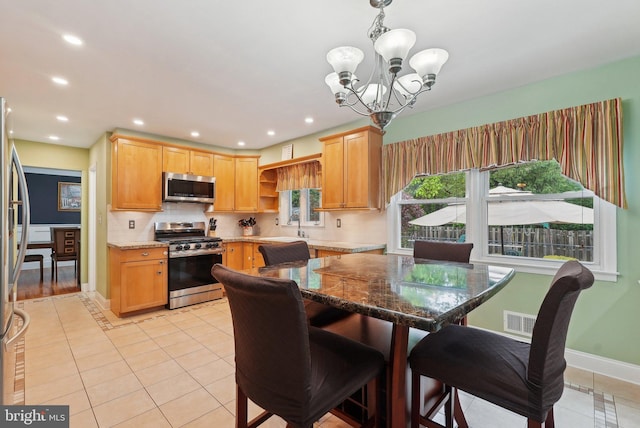 11 Moro Dr, Hamilton, NJ 08619 - dining space with a chandelier, light tile patterned floors, recessed lighting, and baseboards