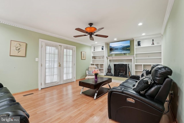 11 Moro Dr, Hamilton, NJ 08619 - living room with crown molding, light wood-type flooring, a ceiling fan, baseboards, and french doors