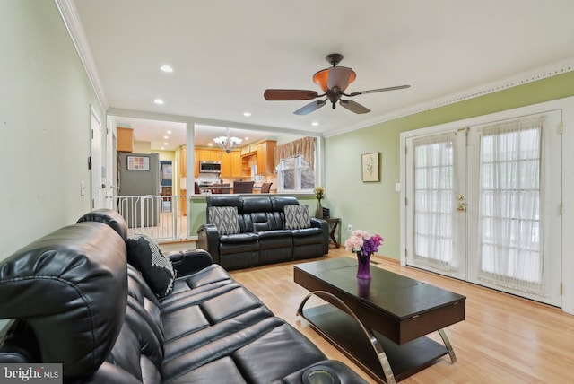 11 Moro Dr, Hamilton, NJ 08619 - living room featuring a chandelier, ceiling fan, ornamental molding, light wood-type flooring, and french doors