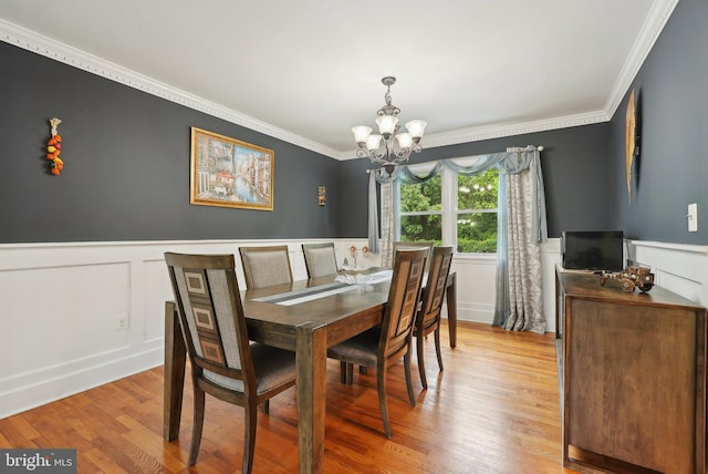 11 Moro Dr, Hamilton, NJ 08619 - dining space with a chandelier, ornamental molding, a wainscoted wall, wood finished floors, and a decorative wall