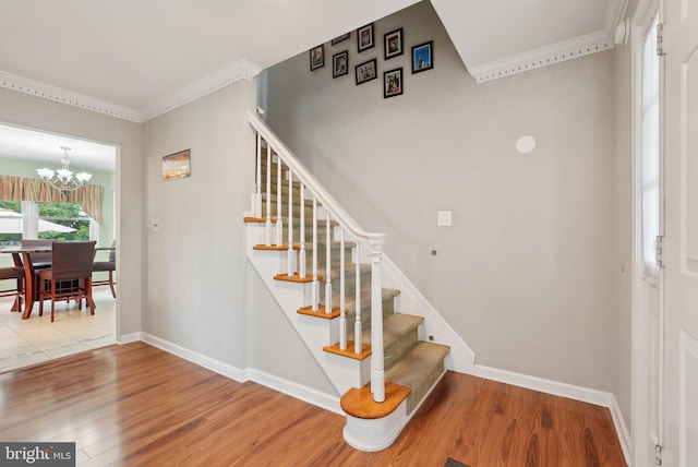 11 Moro Dr, Hamilton, NJ 08619 - stairs featuring crown molding, wood finished floors, a chandelier, and baseboards