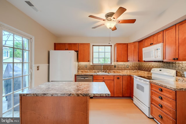 4410 Sophias Way, Belcamp, MD 21017 - kitchen featuring white appliances, plenty of natural light, a ceiling fan, and a sink