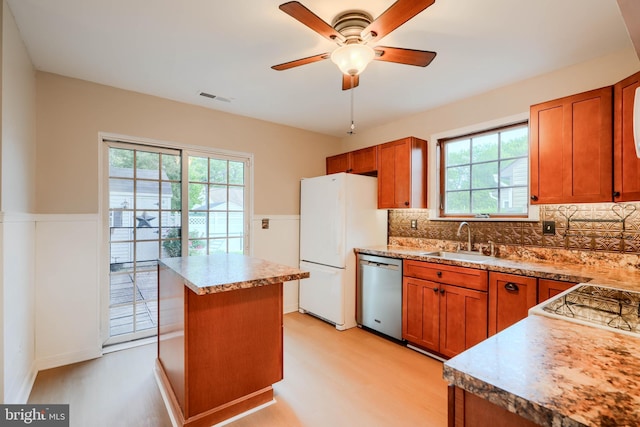 4410 Sophias Way, Belcamp, MD 21017 - kitchen with dishwasher, a sink, freestanding refrigerator, healthy amount of natural light, and a wainscoted wall