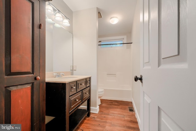 4410 Sophias Way, Belcamp, MD 21017 - bathroom with toilet, vanity, wood finished floors, baseboards, and bathing tub / shower combination