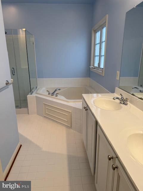 12318 Cherry Branch Dr, Clarksburg, MD 20871 - bathroom featuring a bath, a stall shower, double vanity, and tile patterned floors
