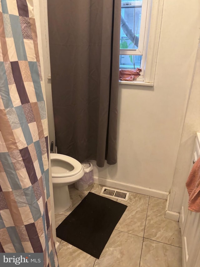 3910 N 8th St, Philadelphia, PA 19140 - bathroom with toilet and tile patterned floors