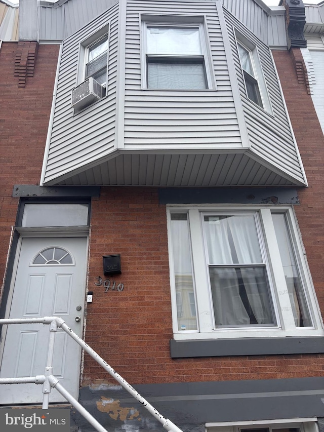 3910 N 8th St, Philadelphia, PA 19140 - property entrance with brick siding and cooling unit