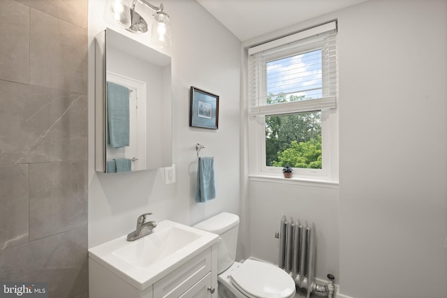 2456 20th St NW Unit 507, Washington, DC 20009 - half bath featuring radiator, vanity, and toilet