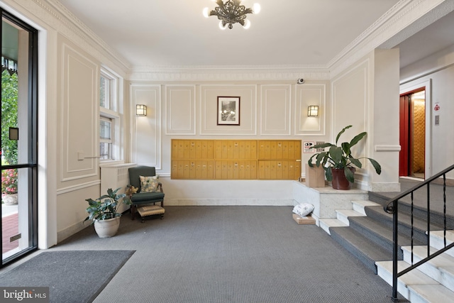 2456 20th St NW Unit 507, Washington, DC 20009 - living area featuring carpet flooring, a chandelier, crown molding, and stairs
