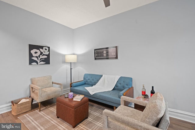 2456 20th St NW Unit 507, Washington, DC 20009 - living area with baseboards, wood finished floors, and ceiling fan
