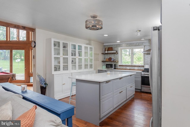 7430 Joes Creek Rd, Linville, VA 22834 - kitchen with stainless steel appliances, light countertops, a kitchen island, hardwood / wood-style flooring, and open shelves