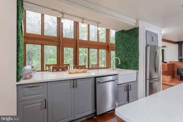 7430 Joes Creek Rd, Linville, VA 22834 - kitchen featuring stainless steel appliances, gray cabinetry, a sink, and dark wood finished floors