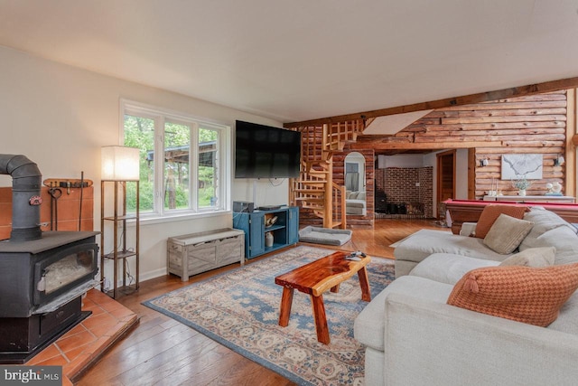 7430 Joes Creek Rd, Linville, VA 22834 - living area featuring a wood stove, wood-type flooring, and baseboards