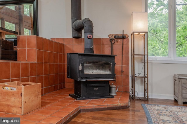 7430 Joes Creek Rd, Linville, VA 22834 - detailed view of wood finished floors, baseboards, and a wood stove