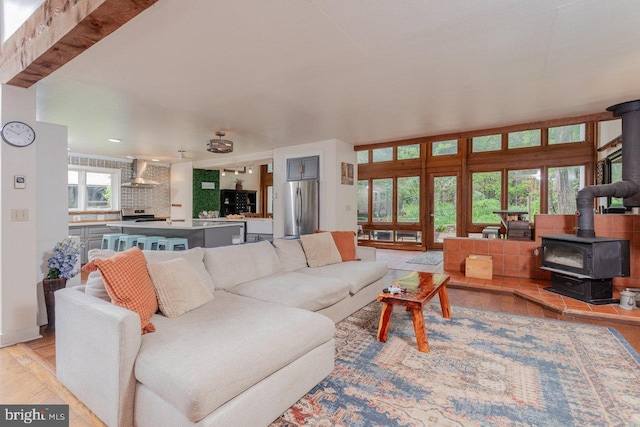 7430 Joes Creek Rd, Linville, VA 22834 - living room featuring a wood stove and light wood-style floors