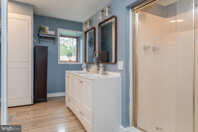 7430 Joes Creek Rd, Linville, VA 22834 - full bathroom featuring a shower stall, wood finished floors, baseboards, and double vanity