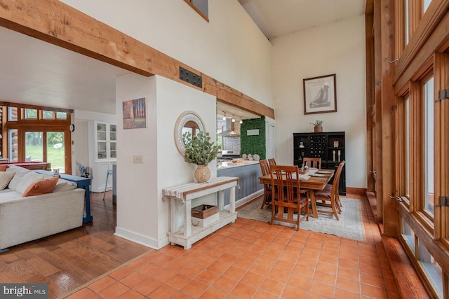 7430 Joes Creek Rd, Linville, VA 22834 - dining space with a towering ceiling, baseboards, and light tile patterned floors