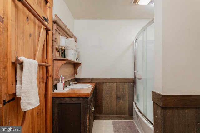 7430 Joes Creek Rd, Linville, VA 22834 - full bath with tile patterned floors, bath / shower combo with glass door, vanity, and wainscoting