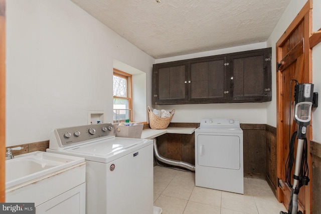 7430 Joes Creek Rd, Linville, VA 22834 - laundry area featuring cabinet space, washing machine and clothes dryer, light tile patterned flooring, and a textured ceiling