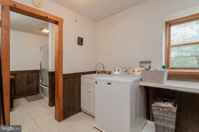 7430 Joes Creek Rd, Linville, VA 22834 - washroom featuring washer / clothes dryer, cabinet space, a wainscoted wall, and light tile patterned floors