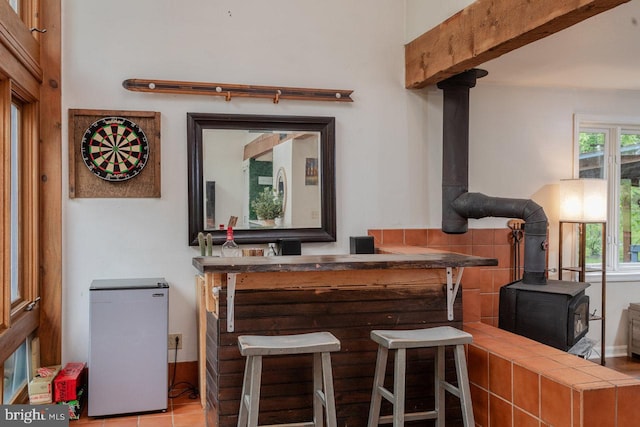 7430 Joes Creek Rd, Linville, VA 22834 - indoor dry bar featuring a wood stove and refrigerator