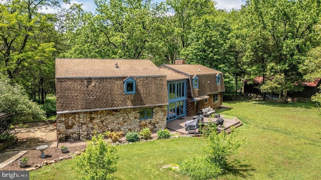 7430 Joes Creek Rd, Linville, VA 22834 - back of house with a gambrel roof, a yard, a shingled roof, stone siding, and a chimney