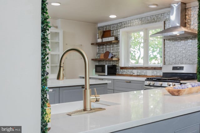 7430 Joes Creek Rd, Linville, VA 22834 - kitchen featuring wall chimney range hood, stainless steel gas stove, gray cabinets, open shelves, and light countertops