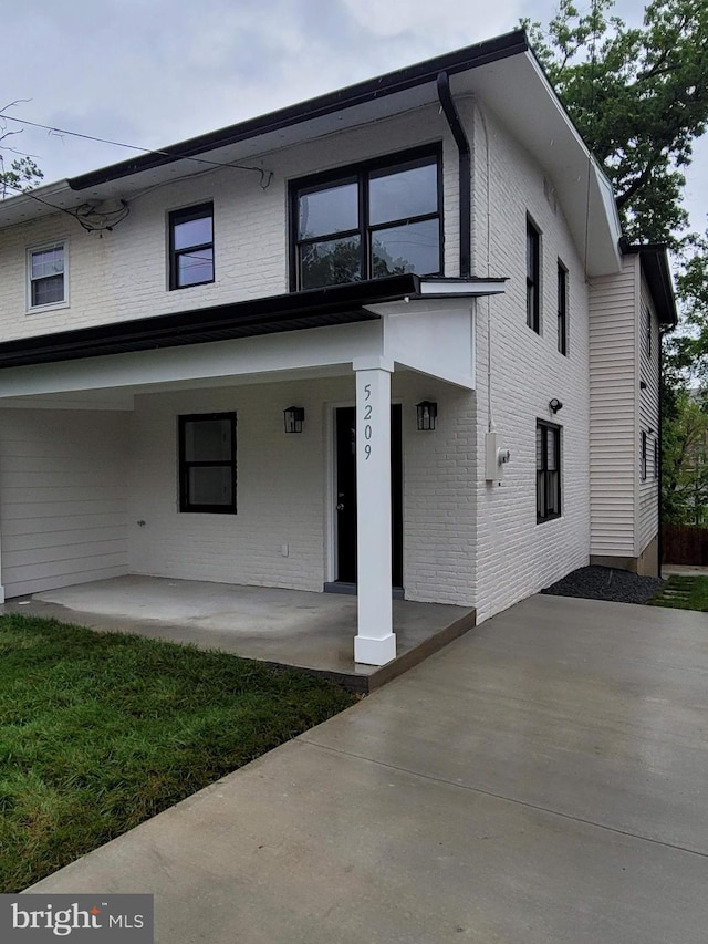 5209 10th Pl S, Arlington, VA 22204 - view of front of property featuring brick siding and covered porch