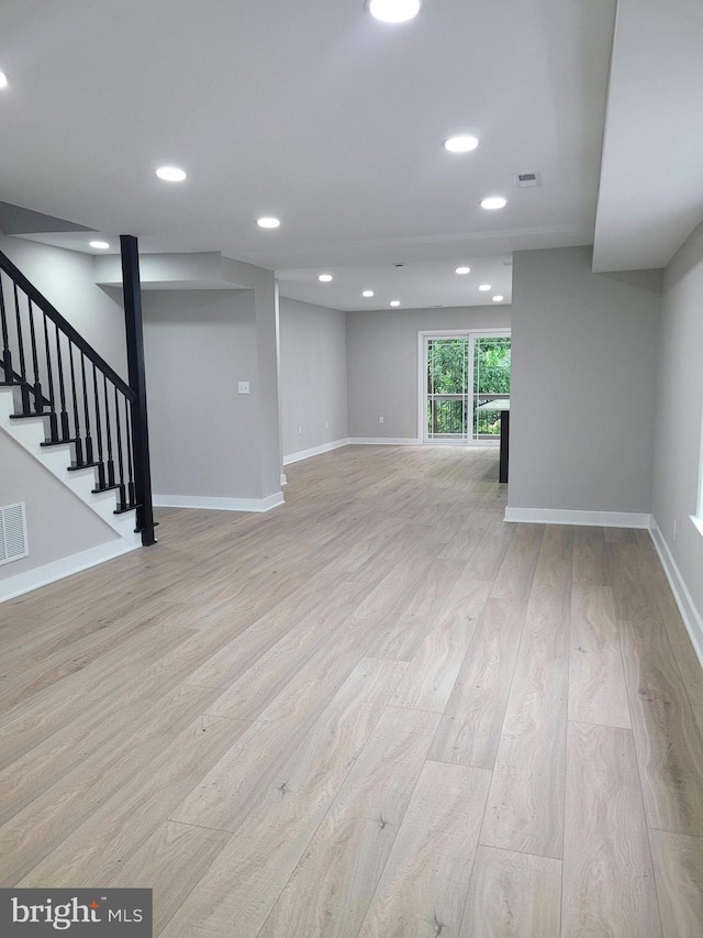 5209 10th Pl S, Arlington, VA 22204 - below grade area featuring light wood-style flooring, baseboards, recessed lighting, and stairs