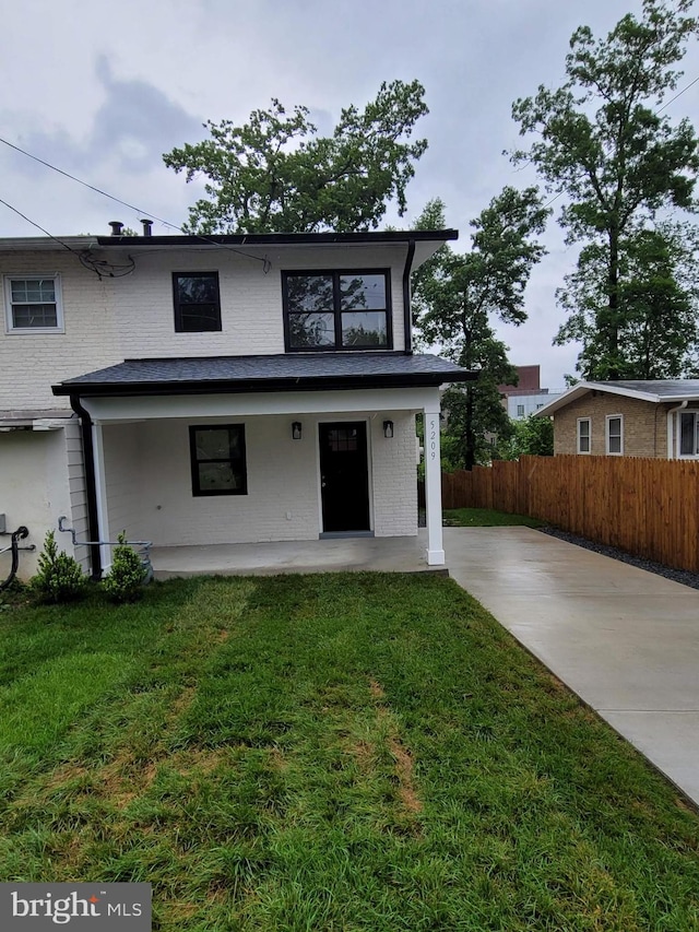 5209 10th Pl S, Arlington, VA 22204 - view of front of house featuring a patio, concrete driveway, and brick siding