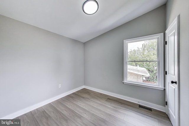5209 10th Pl S, Arlington, VA 22204 - unfurnished room with vaulted ceiling, wood finished floors, and baseboards