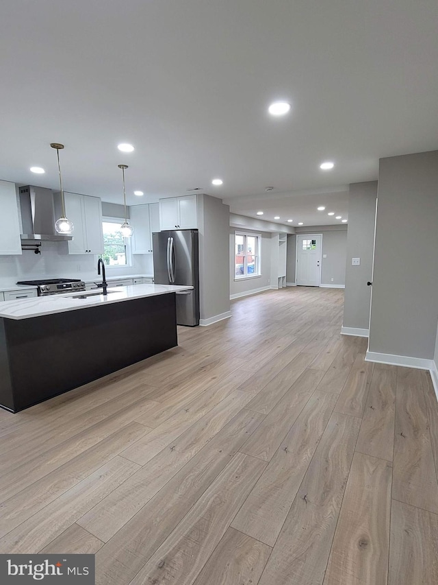 5209 10th Pl S, Arlington, VA 22204 - kitchen featuring stainless steel appliances, light countertops, light wood-type flooring, a sink, and recessed lighting